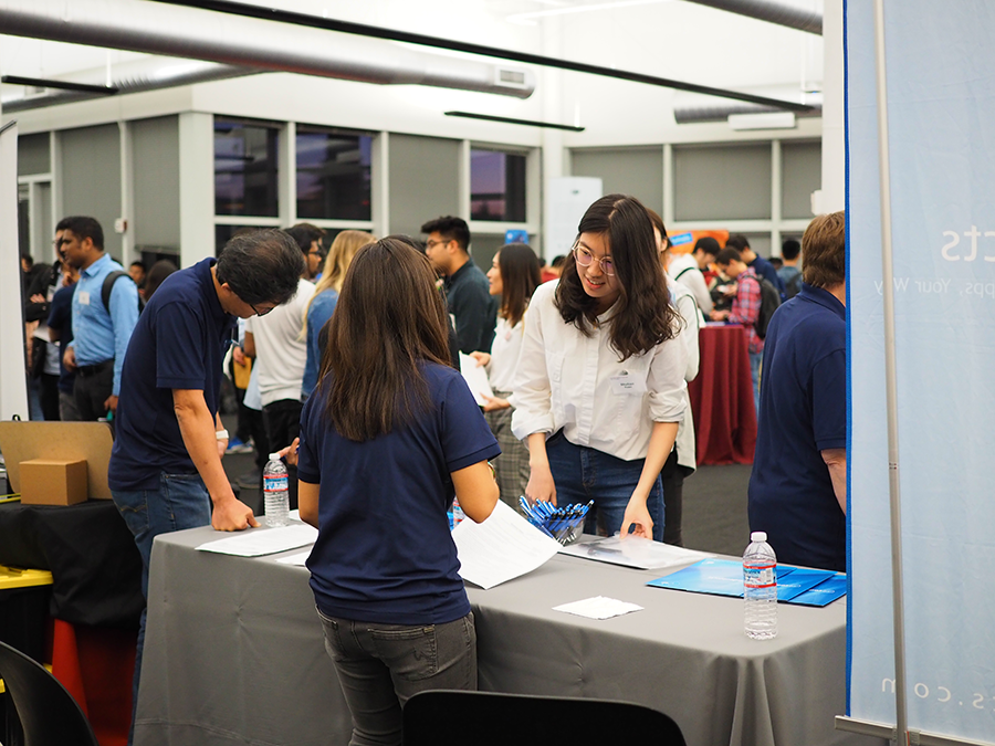 Student and recruiter talking across a table at the 2019 event