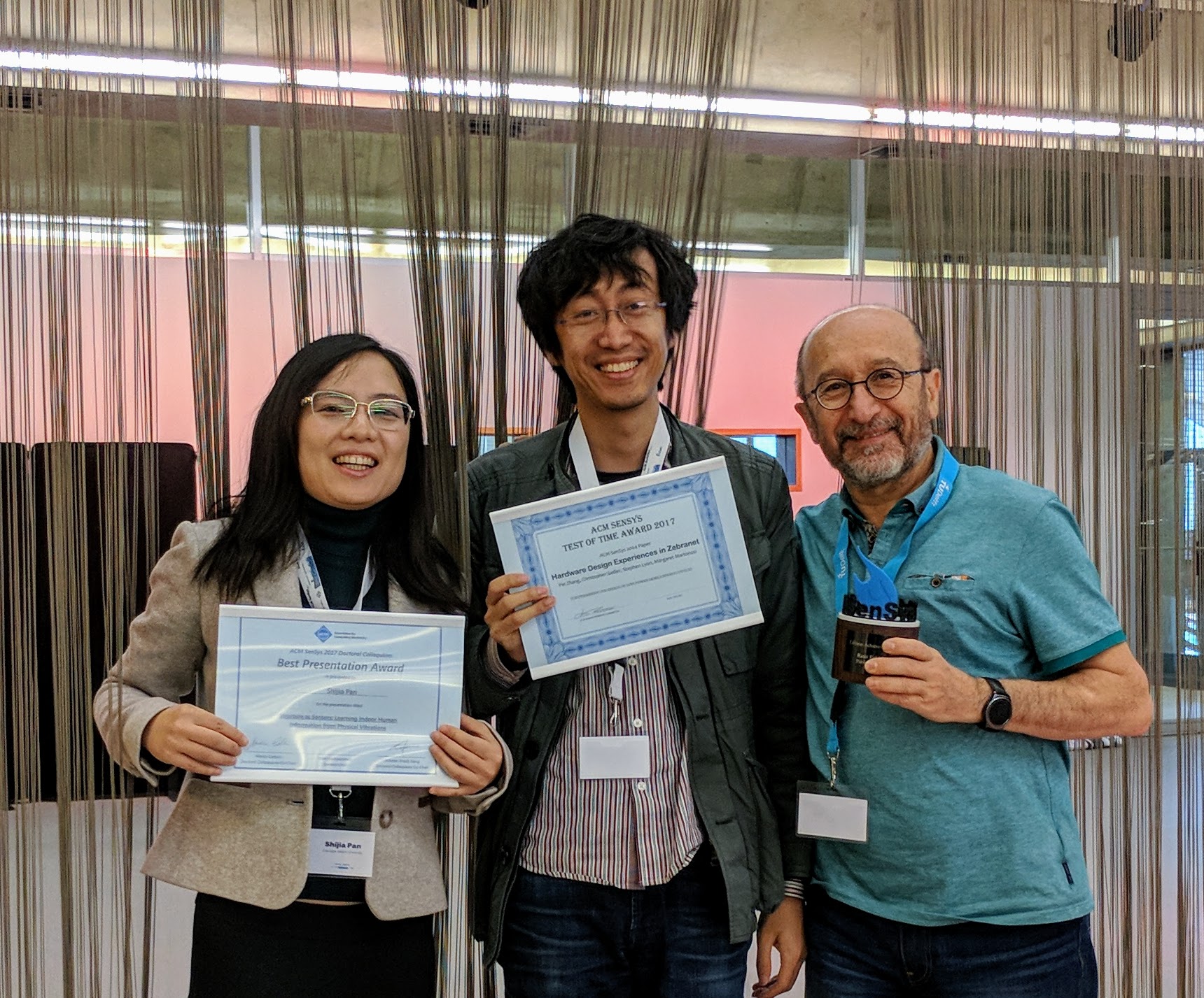 Pei Zhang stands with Shijia Pan, CMU-SV Ph.D. student, who also won an award.