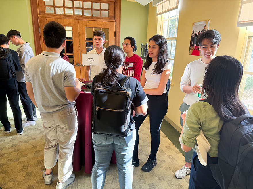 Students and alumni gather at mixer